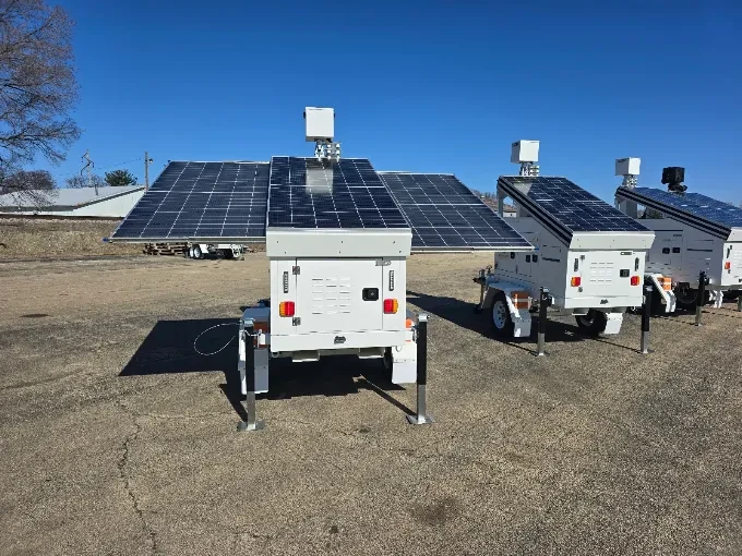 Solar-powered mobile security trailers with large solar panels and mounted cameras